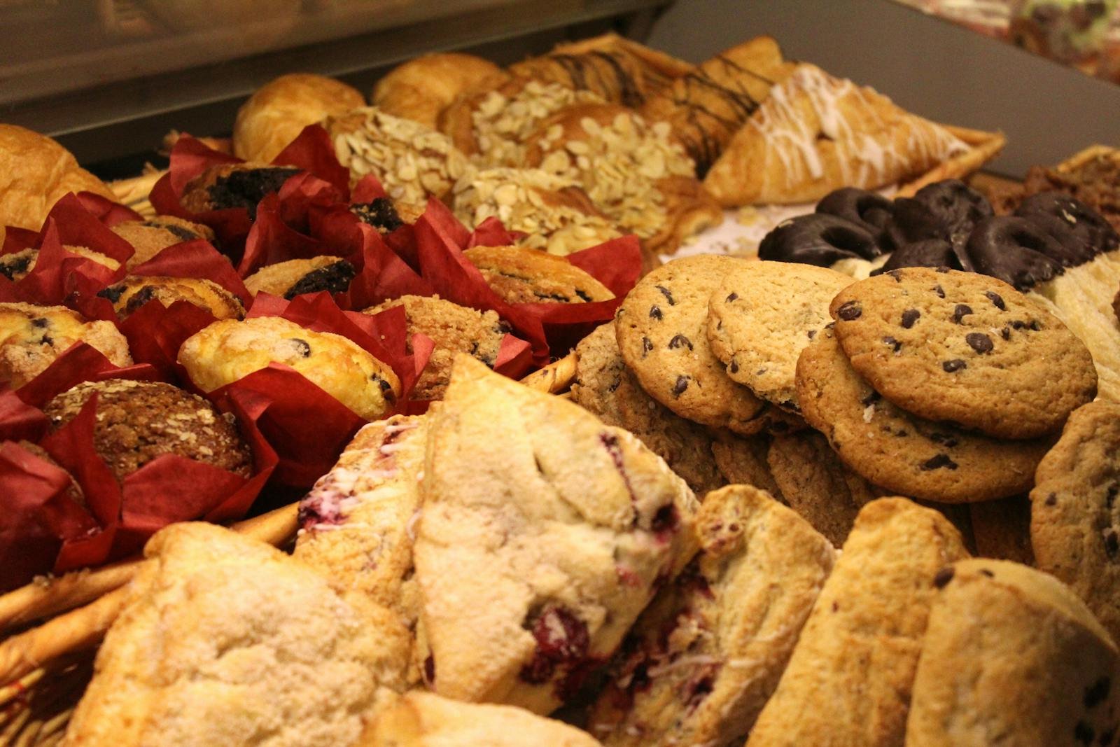 A delicious assortment of baked goods including cookies, muffins, and pastries ideal for breakfast or snack.