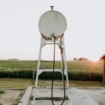 white satellite dish on brown wooden dock during daytime