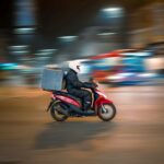 man riding motorcycle on road during daytime