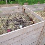 a couple of wooden boxes filled with dirt