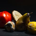 a group of fruits and vegetables sitting on a table