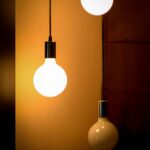 Composition of three glowing light bulbs creating a warm ambiance. Ideal for energy and design themes.