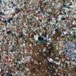Aerial shot showing extensive environmental pollution at a landfill site.