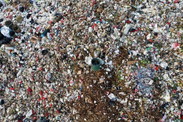 Aerial shot showing extensive environmental pollution at a landfill site.