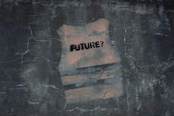 Street art in Venice with text 'FUTURE?' on cracked concrete wall.