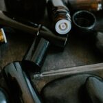 Close-up of essential oil bottles and smooth stones for aromatherapy.