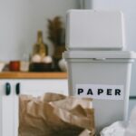 Recycling bin for paper in a kitchen, promoting sustainability and zero waste.