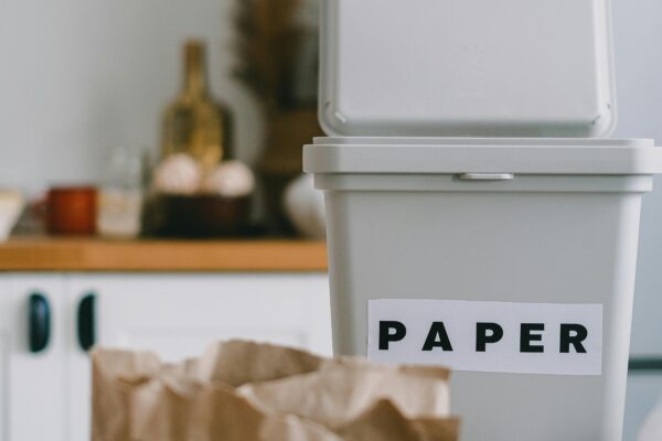 Recycling bin for paper in a kitchen, promoting sustainability and zero waste.