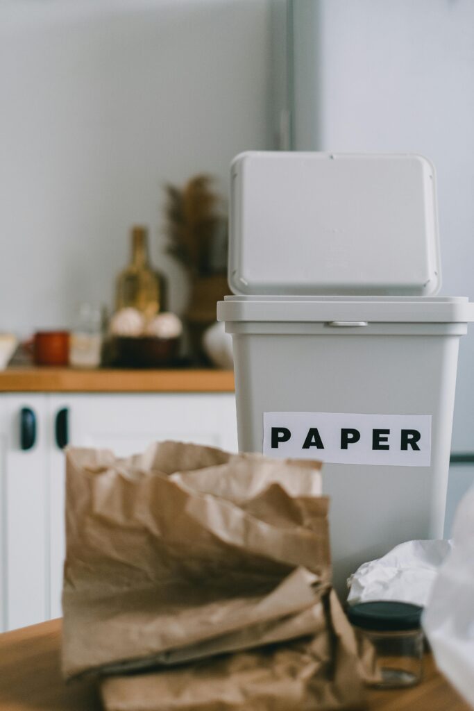 Recycling bin for paper in a kitchen, promoting sustainability and zero waste.